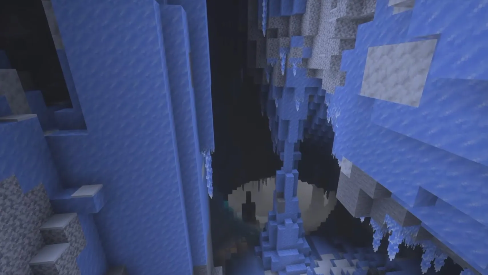 Gouffre profond des Ice Caves avec stalactites de glace et cristaux dans Minecraft